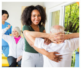 caregiver assisting senior with the exercise