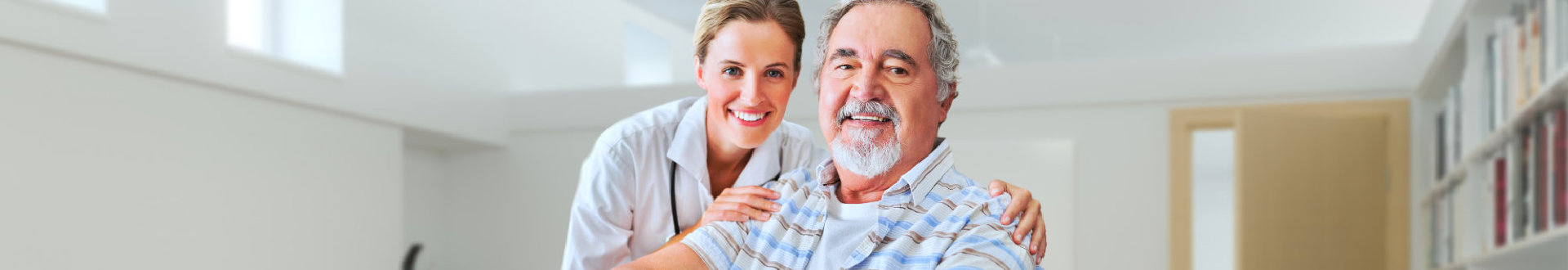 senior man and his caregiver smiling