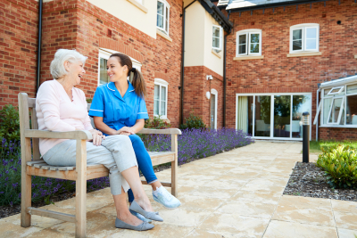 caregiver and a senior outside