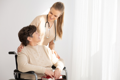 caregiver and senior looking each other