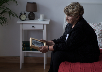 senior holding a picture frame