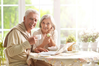 Beautiful elderly couple having breakfast